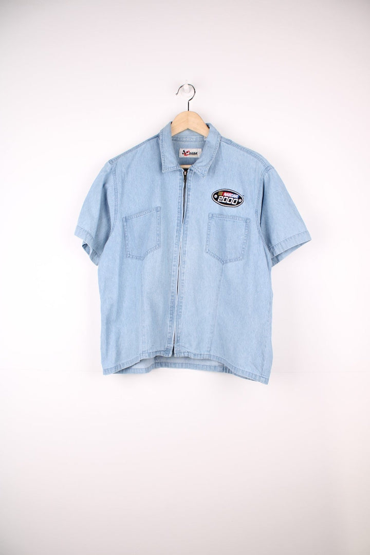 Nascar zip through denim shirt with pockets and embroidered badge on the chest.