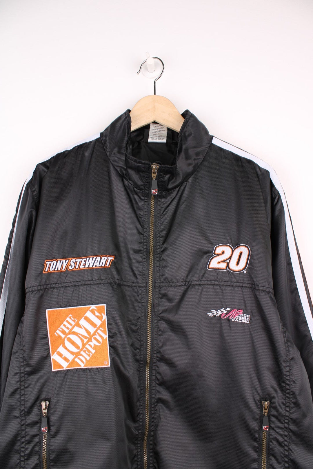 NASCAR Tony Stewart zip through jacket in black and orange with embroidered badges.