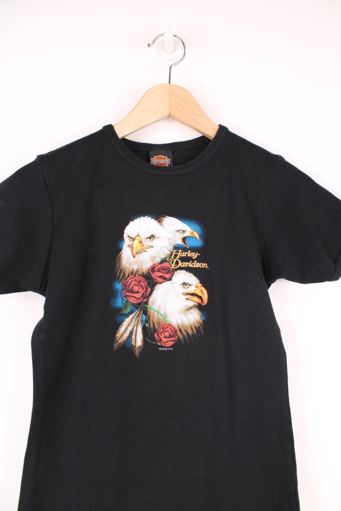 Y2K Harley Davidson Baby Tee in a black colourway, Chester England, and has eagles and roses printed on the front, and on the back a centurion biker. 