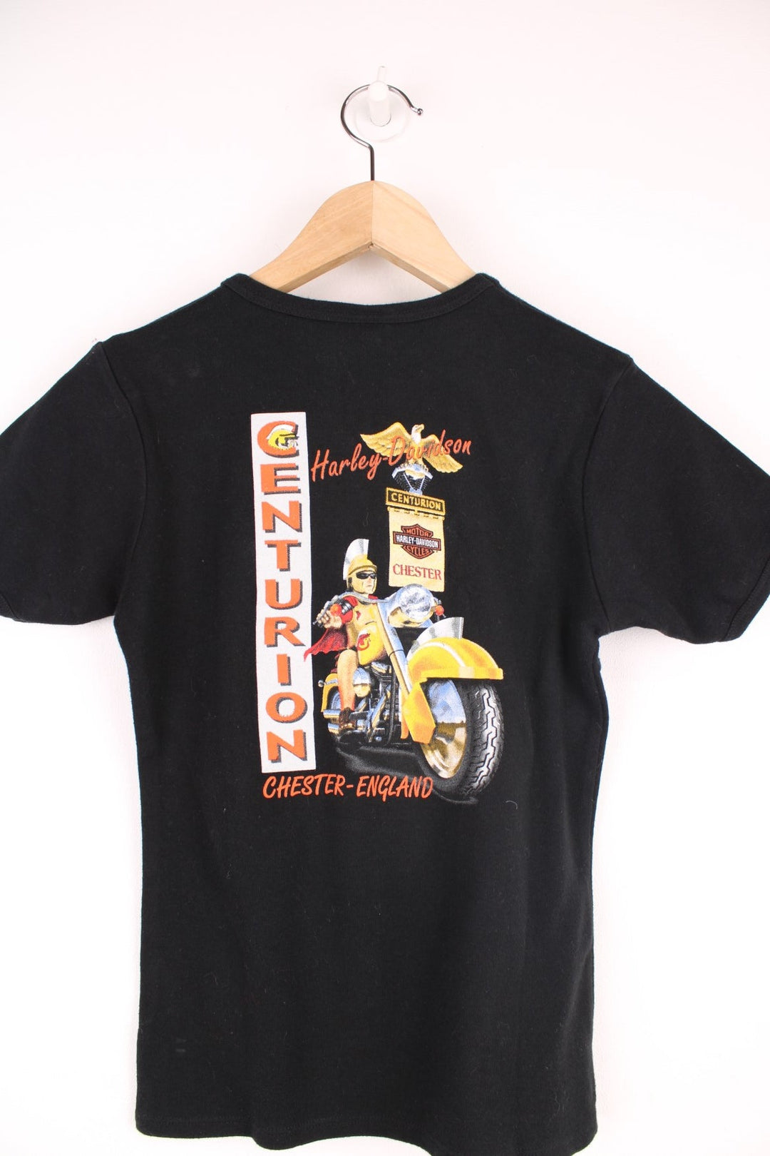 Y2K Harley Davidson Baby Tee in a black colourway, Chester England, and has eagles and roses printed on the front, and on the back a centurion biker. 