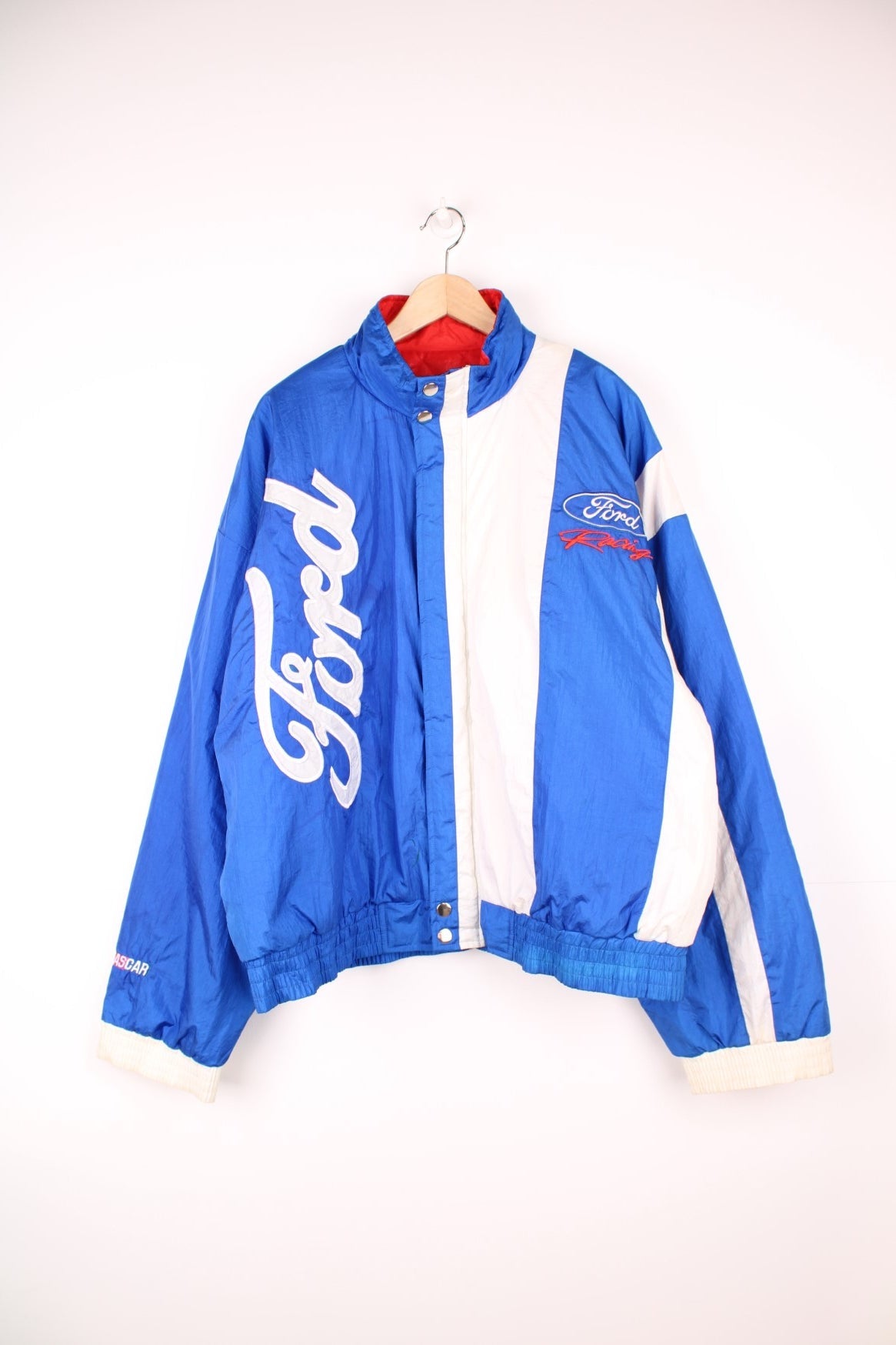 Ford Racing Jacket in a blue and white colourway, zip up with side pockets, insulated with a quilted lining and has the logo embroidered on the front and back. 