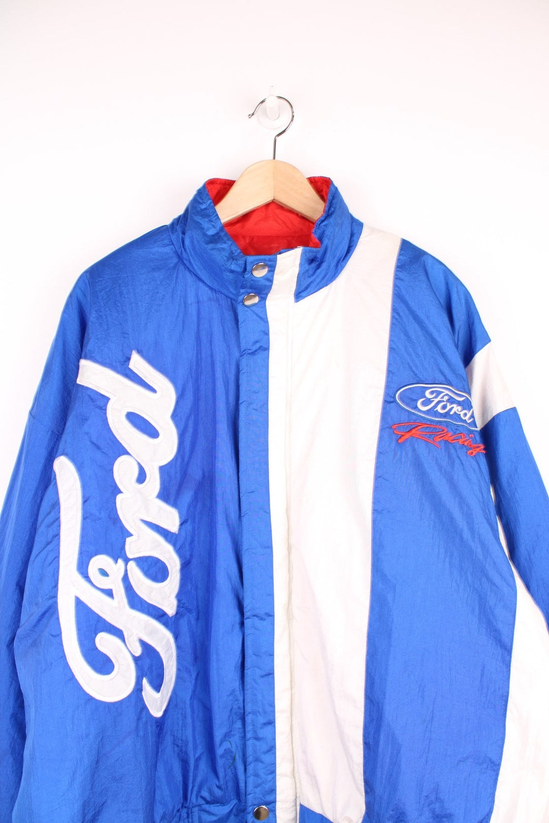 Ford Racing Jacket in a blue and white colourway, zip up with side pockets, insulated with a quilted lining and has the logo embroidered on the front and back. 