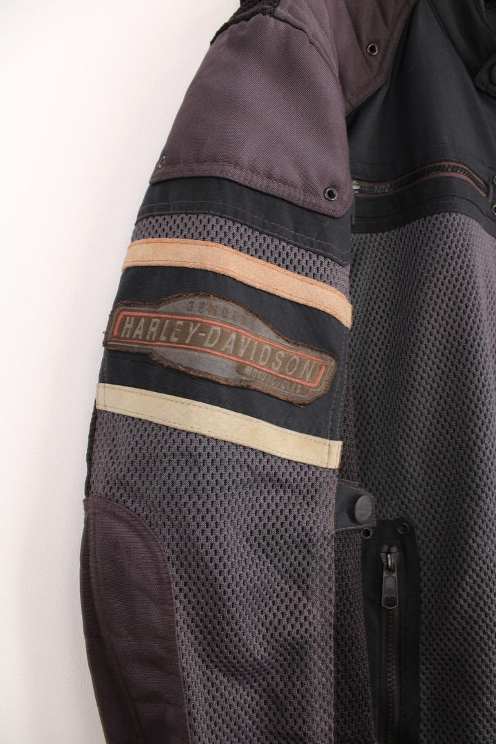 Harley Davidson zip through motorcycle jacket in grey and black, features multiple pockets, and embroidered badges