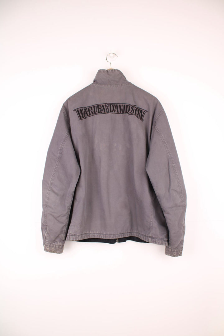 Harley Davidson reversible motorcycle jacket in black and grey colourway. Features embroidered spell-out details across the shoulders and on the front