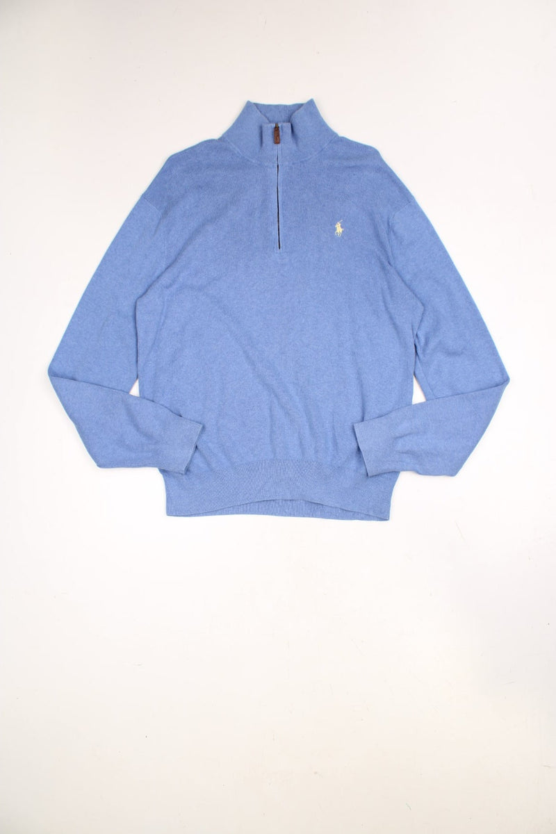 Polo Ralph Lauren 1/4 zip sweatshirt in a blue colourway with the logo embroidered on the chest in yellow.