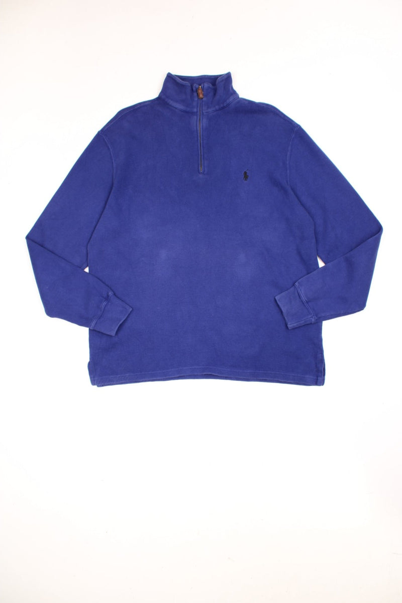 Polo Ralph Lauren 1/4 zip sweatshirt in a blue colourway with the logo embroidered on the chest in black.