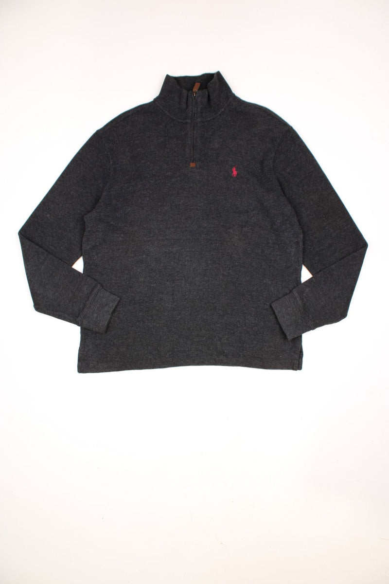 Polo Ralph Lauren 1/4 zip sweatshirt in a dark grey colourway with the logo embroidered on the chest in red. 