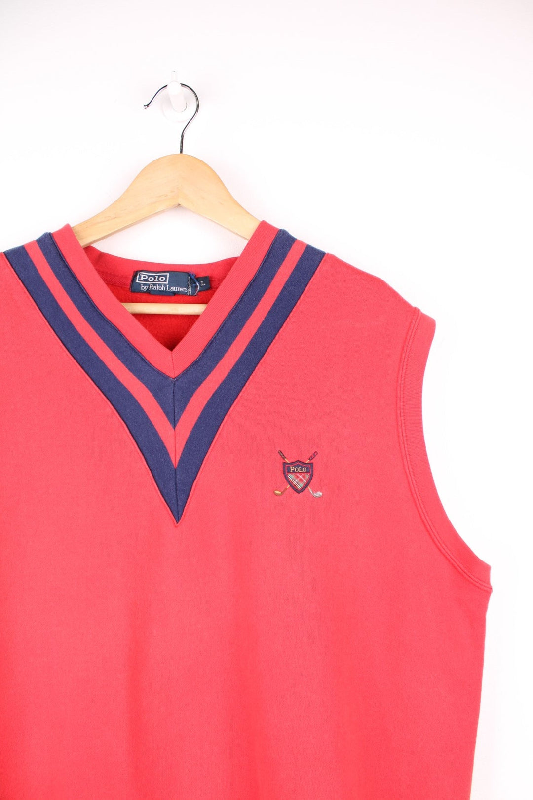 Vintage Polo Ralph Lauren sweater vest in red with navy blue detailing on the neck and embroidered logo on the chest.