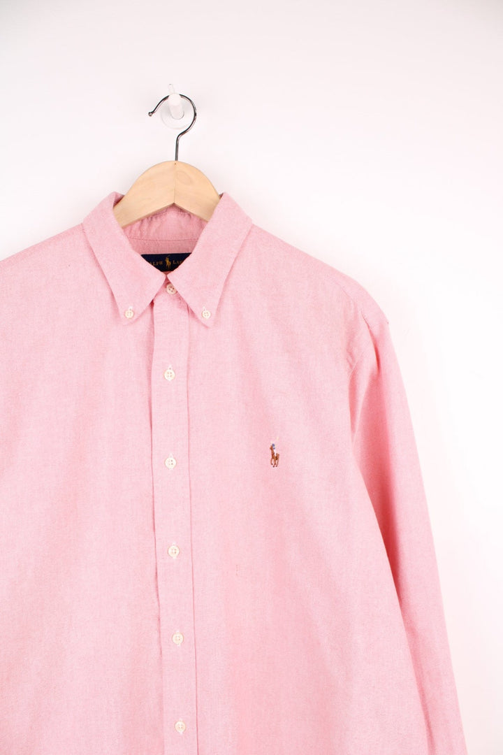 Pink Ralph Lauren button-down shirt with signature Polo logo embroidered in brown. 