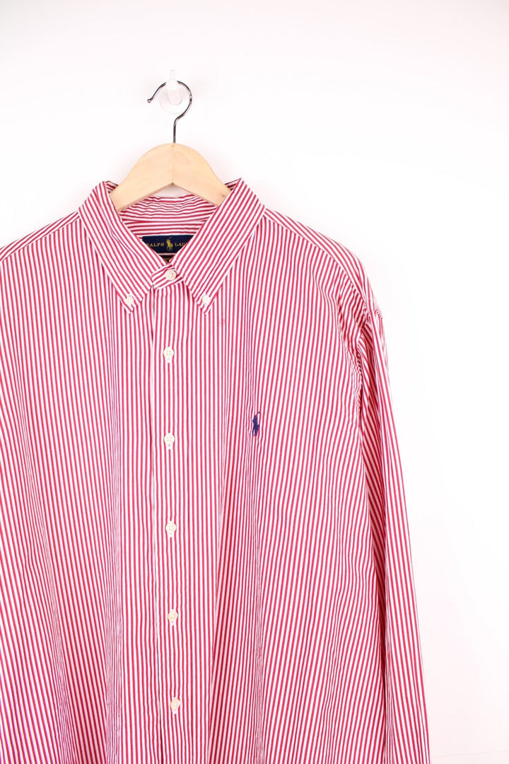 Red and white striped Ralph Lauren button-down shirt with signature Polo logo embroidered in navy blue. 