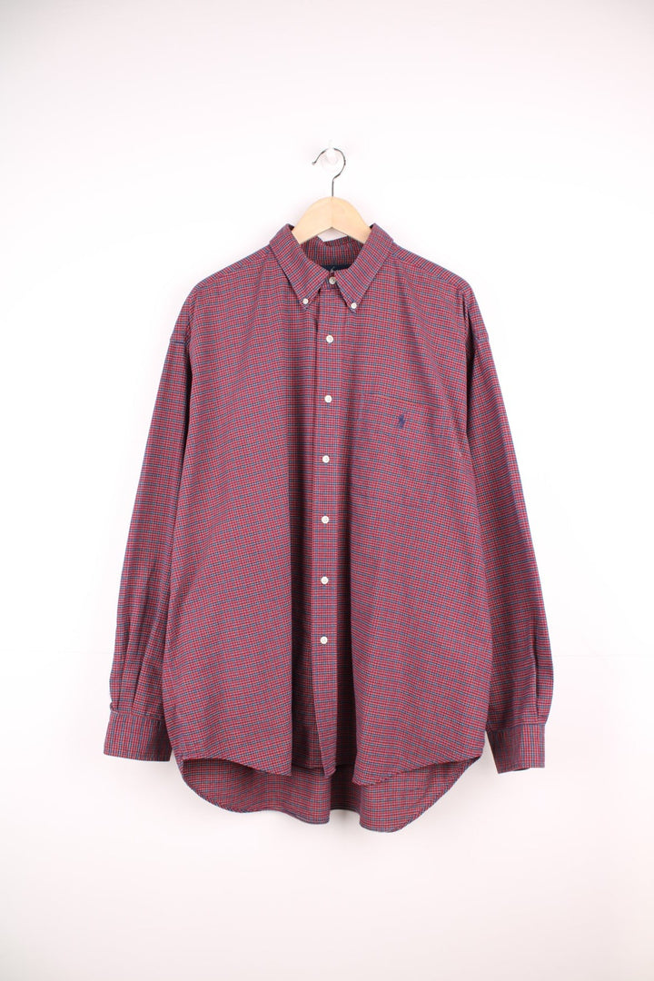 Red and navy blue check Ralph Lauren button-down shirt with a breast pocket and signature Polo logo embroidered in navy blue. 