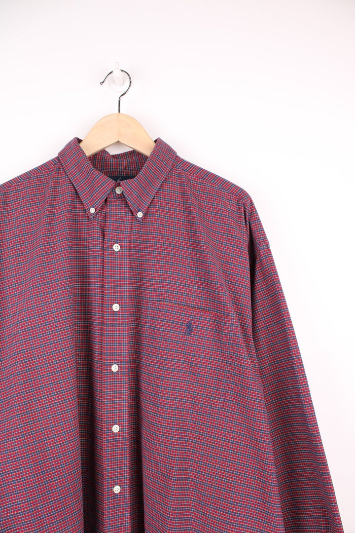 Red and navy blue check Ralph Lauren button-down shirt with a breast pocket and signature Polo logo embroidered in navy blue. 