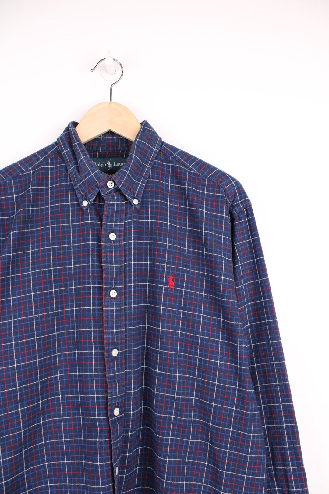 Navy blue, red, and white check Ralph Lauren button-down shirt with signature Polo logo embroidered in red. 