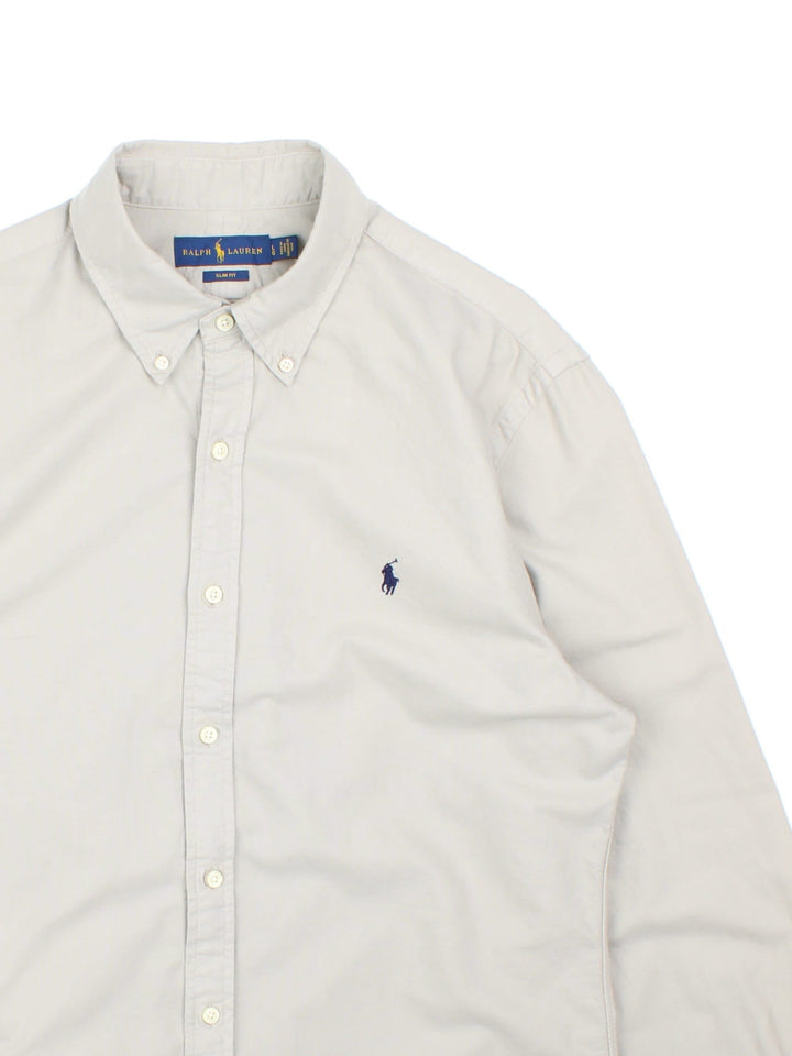 Ralph Lauren Shirt in a grey colourway, button up with the logo embroidered on the front.