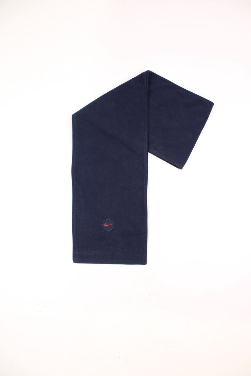 2000's navy blue Nike fleece scarf features embroidered swoosh logo near the hem