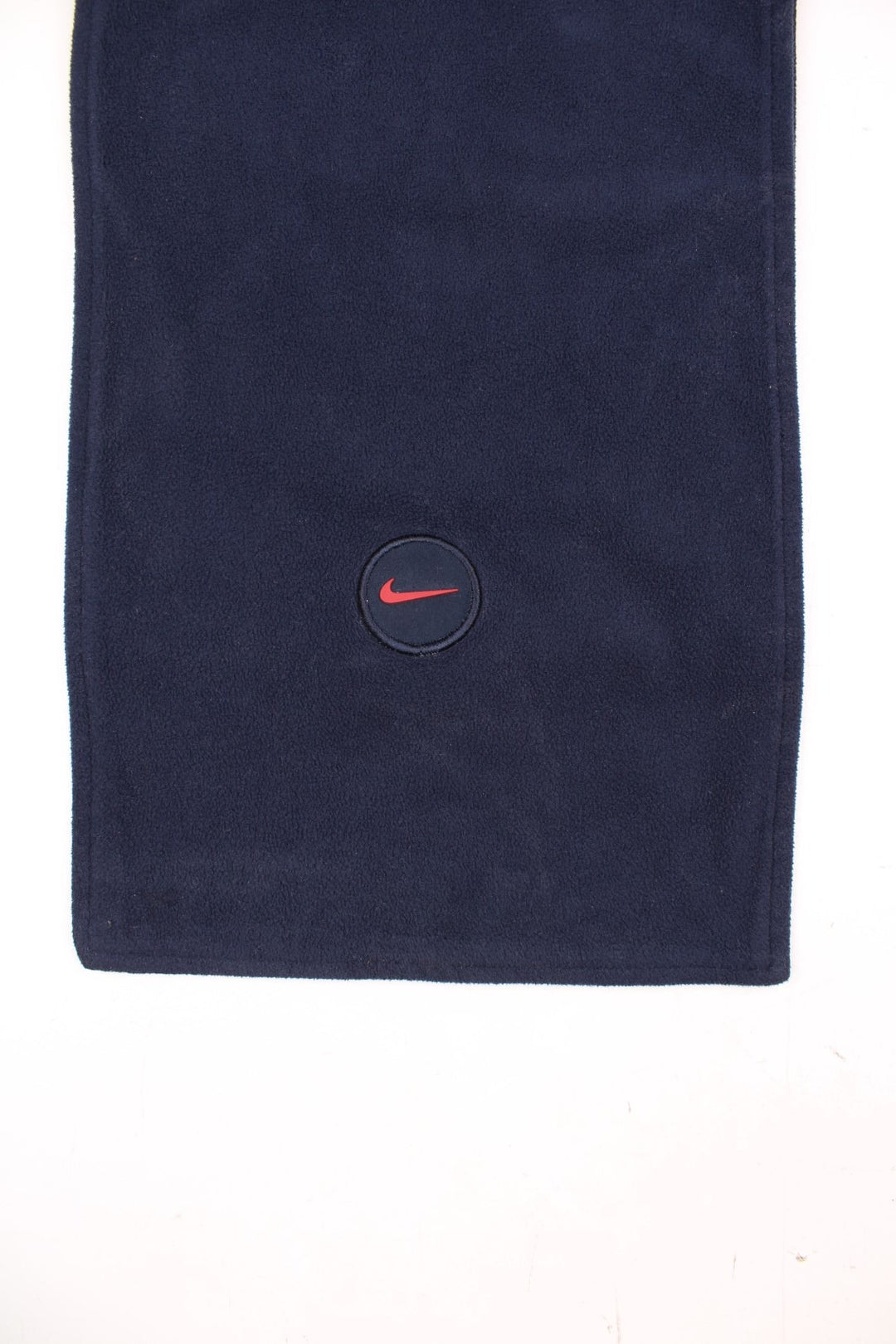 2000's navy blue Nike fleece scarf features embroidered swoosh logo near the hem