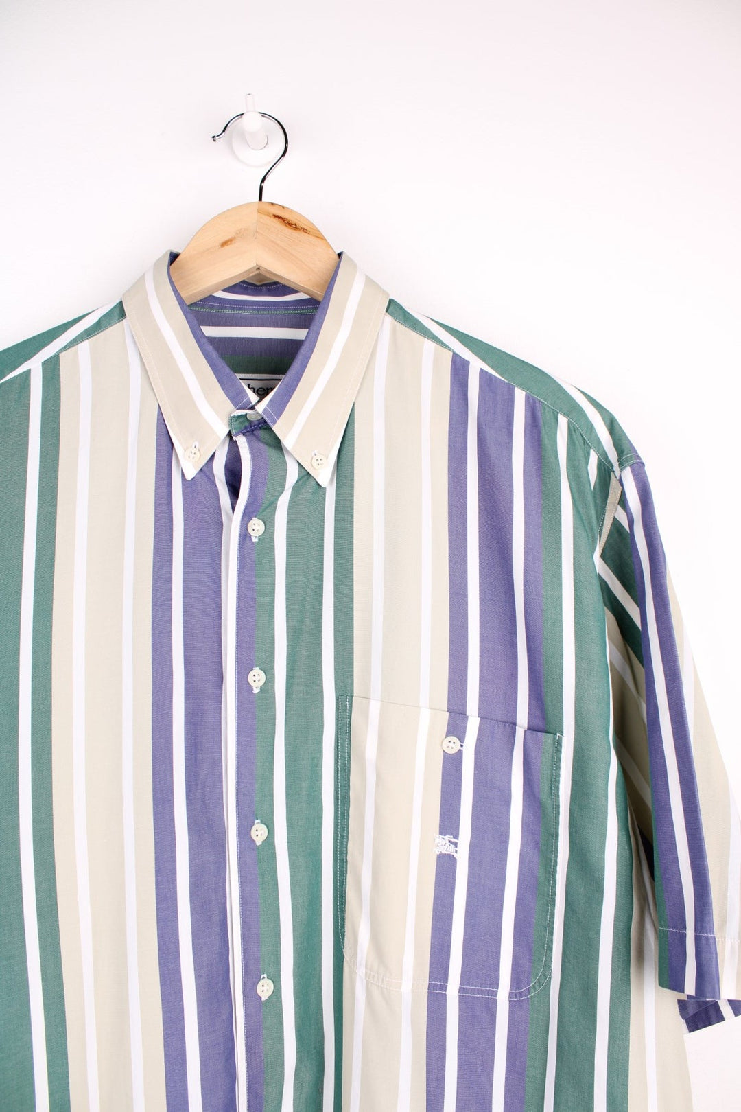 Burberry short-sleeved button-down shirt in blue, green, and tan stripes with vintage 'Burberrys of London' tag inside, button closure, one breast pocket and a small embroidered logo in white.