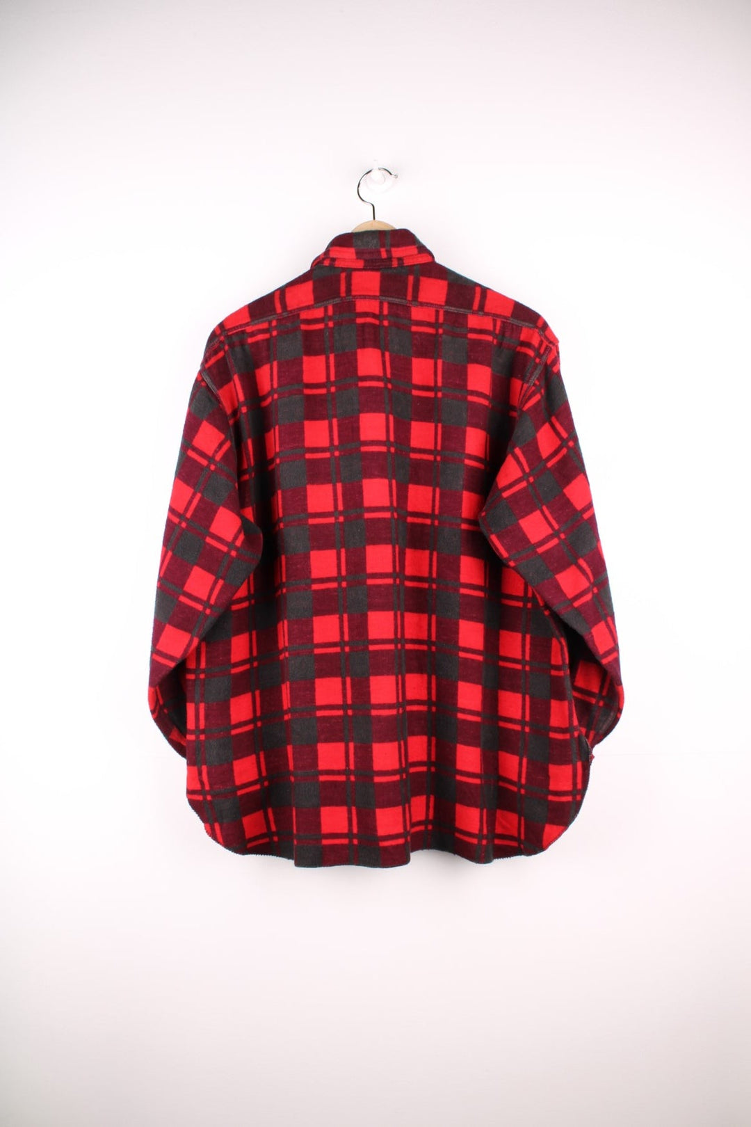 Champion shirt in Red plaid with two pockets and button closure.