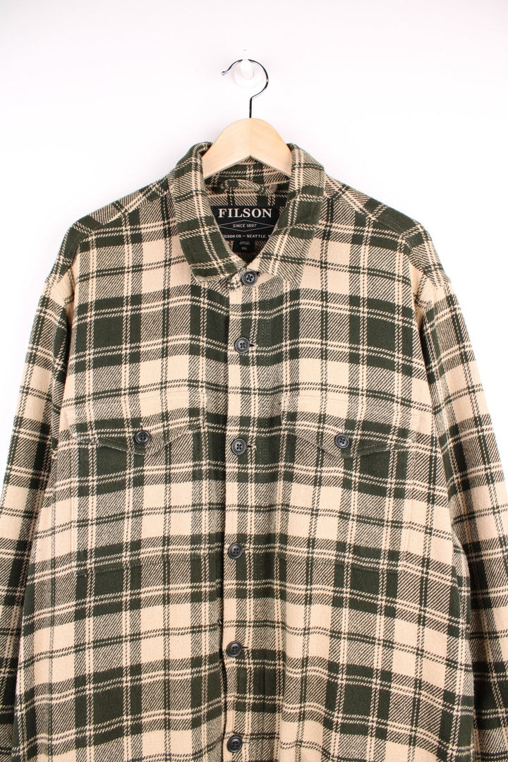 Filson Deer Island Jac shirt in Green and cream plaid with chest and side pockets and button closure.