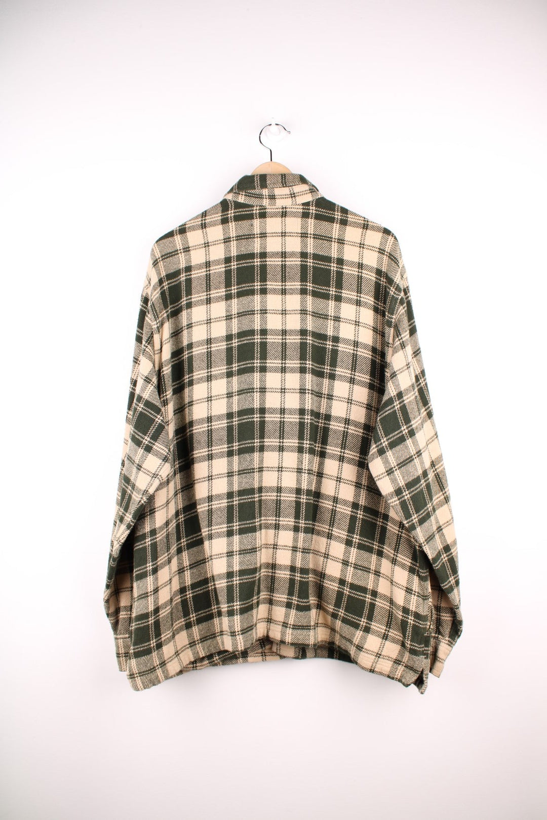 Filson Deer Island Jac shirt in Green and cream plaid with chest and side pockets and button closure.