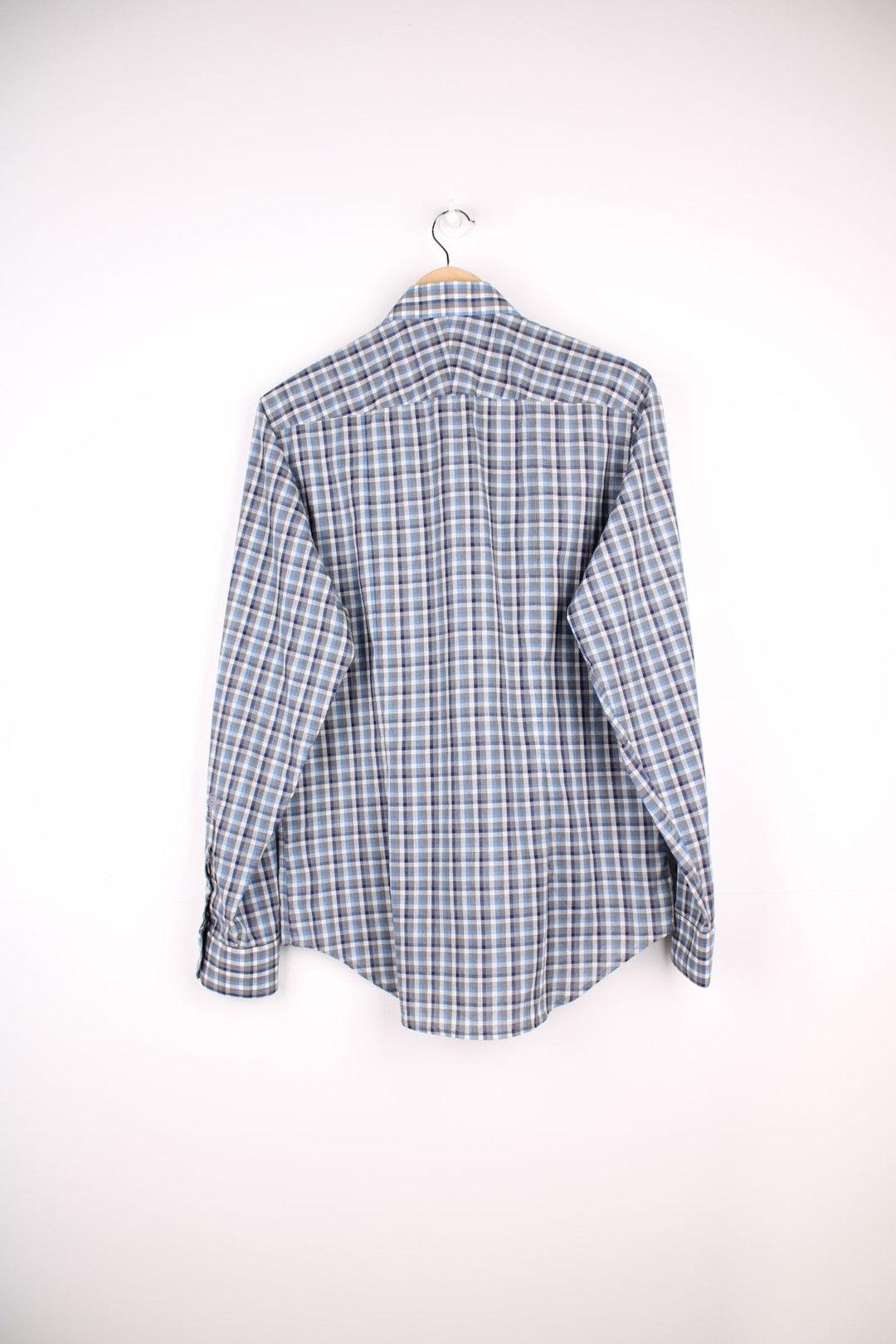 Aquascutum shirt in blue and grey check with button closure.