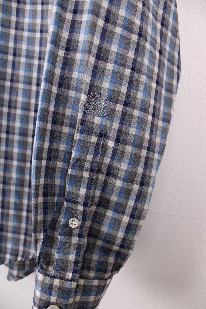 Aquascutum shirt in blue and grey check with button closure.