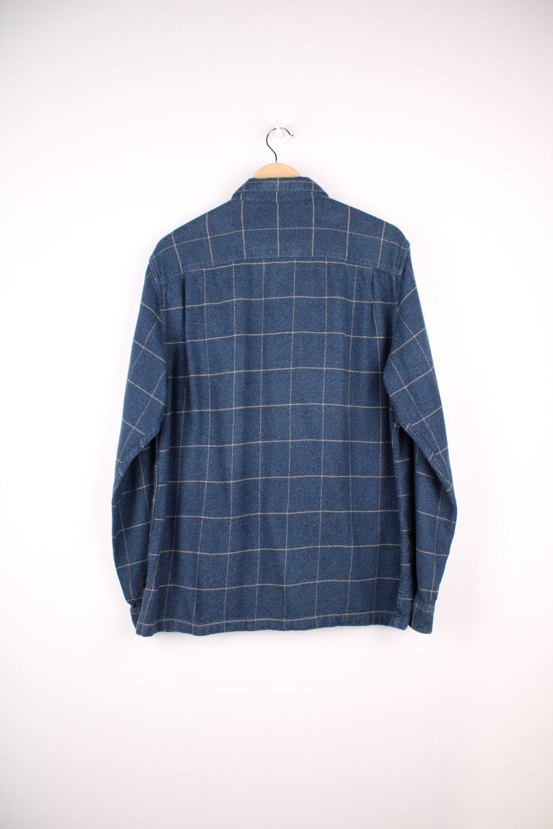 Patagonia organic cotton shirt in blue check with button closure and two chest pockets.