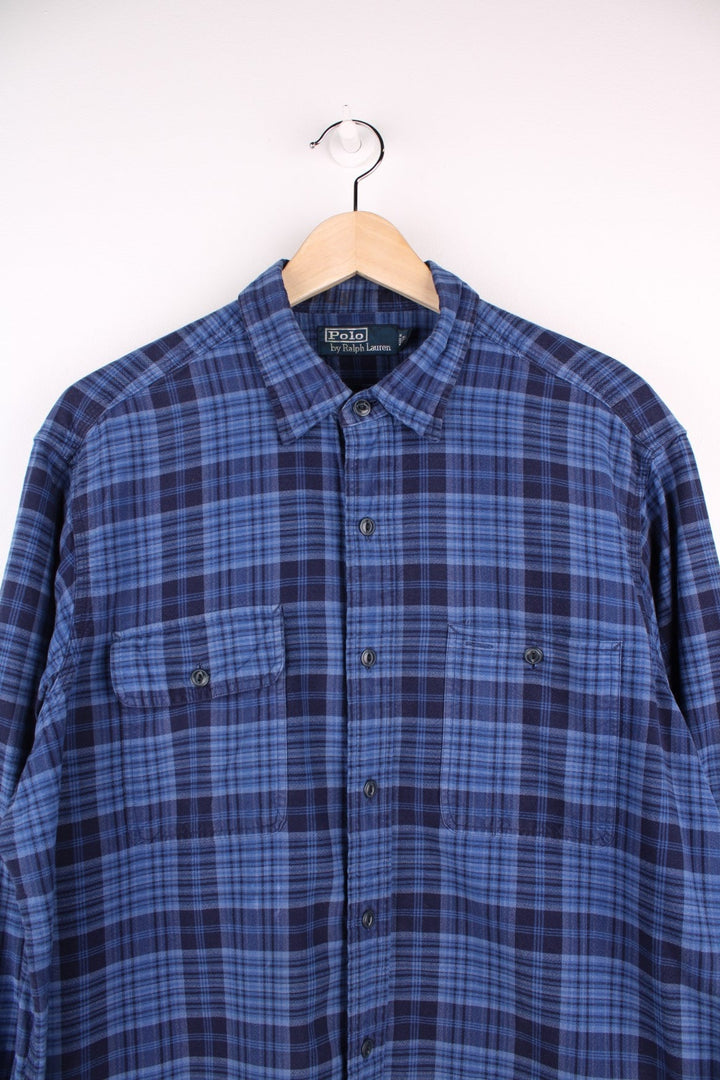 Ralph Lauren shirt in Blue check with two pockets and button closure.