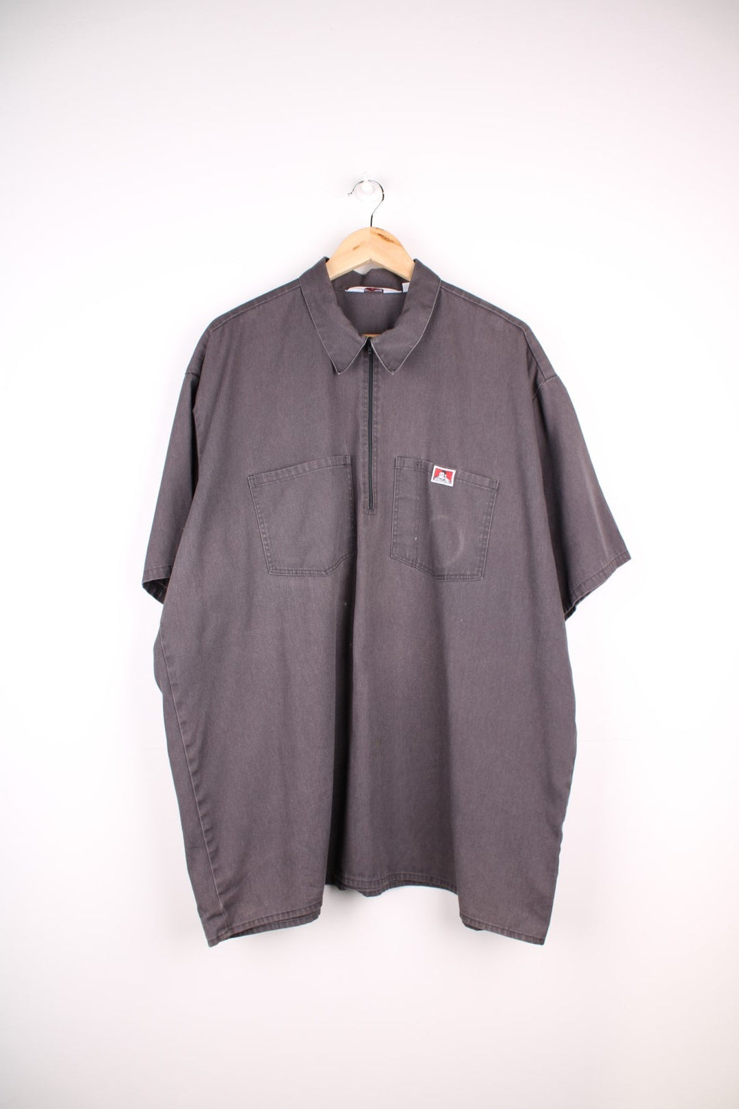 Ben Davis short-sleeved shirt in grey with 1/2 zip closure, two pockets, and a small embroidered monkey logo patch.