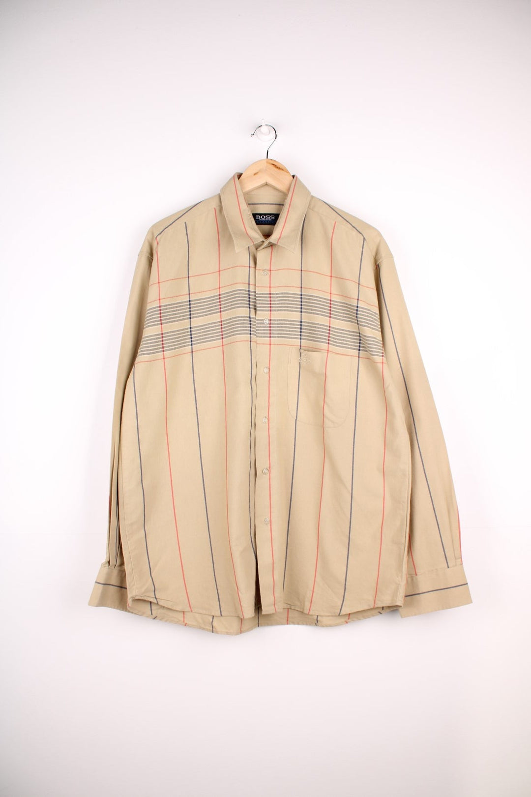 Vintage Hugo Boss shirt in tan with grey and red check design, button closure, one chest pocket and a small embroidered logo.