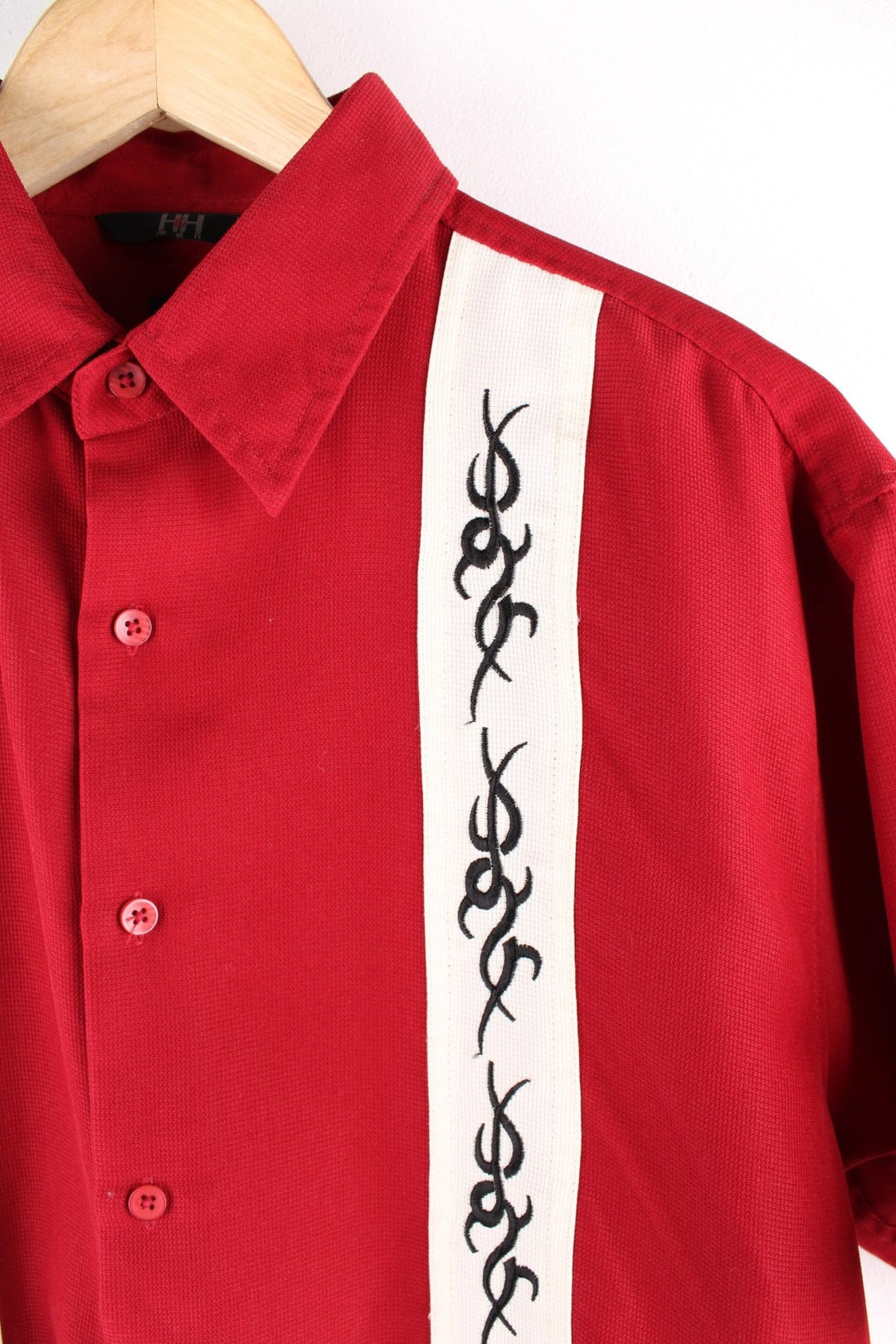 Y2K Tribal short-sleeved shirt by H&H in red with white stripes and black tribal designs.