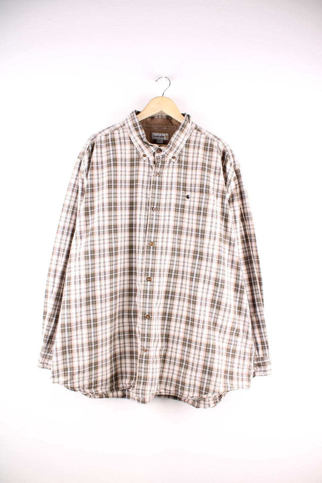 Carhartt button-down shirt in tan and grey check, with one breast pocket and a small C logo embroidered in black.