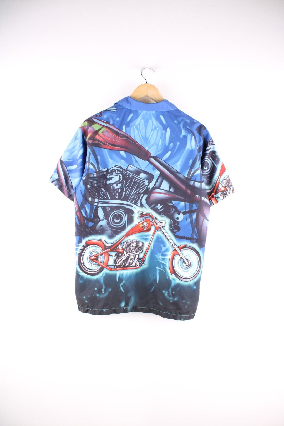 Y2K Racing short-sleeved shirt in blue with large cartoonish motorbike print and button closure.