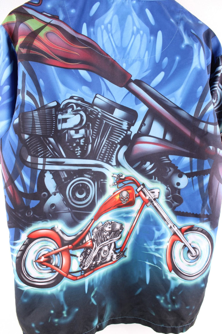 Y2K Racing short-sleeved shirt in blue with large cartoonish motorbike print and button closure.