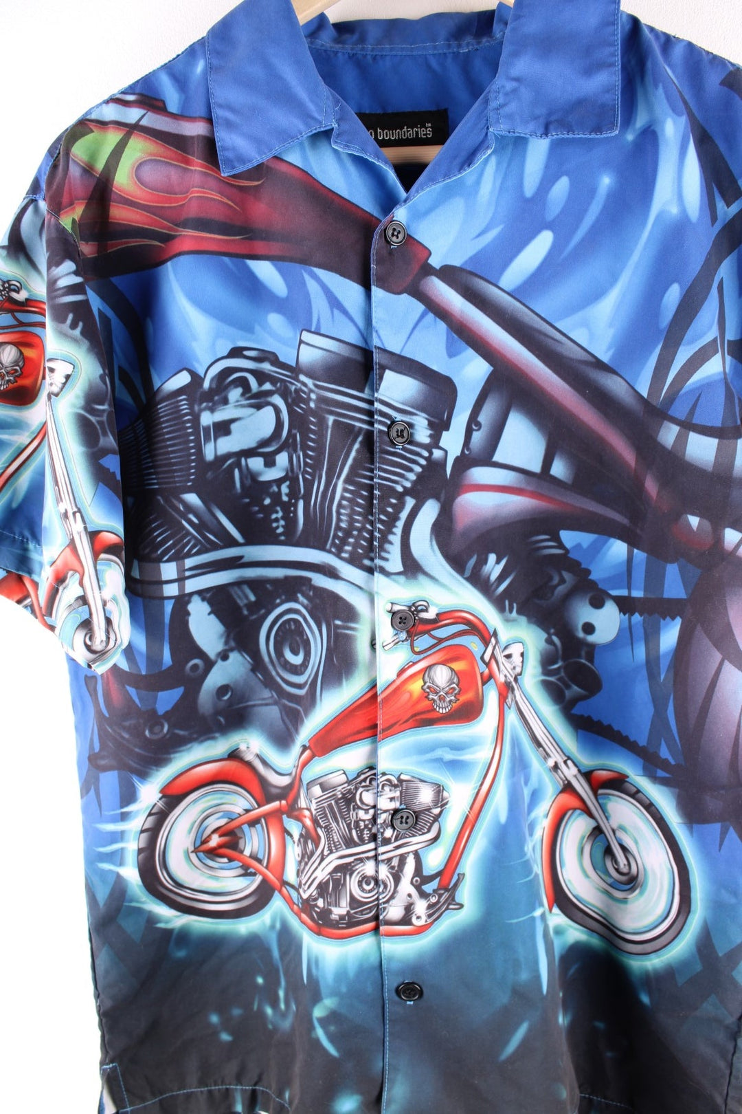 Y2K Racing short-sleeved shirt in blue with large cartoonish motorbike print and button closure.