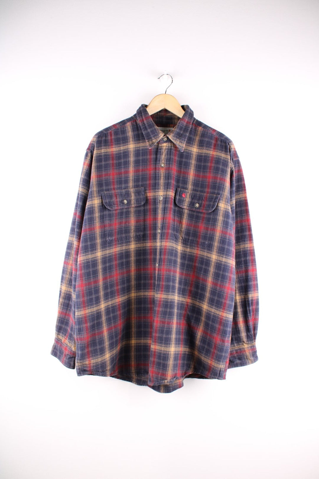 Carhartt shirt in blue, red, and yellow check, with two buttoned breast pockets and an embroidered logo on the chest.