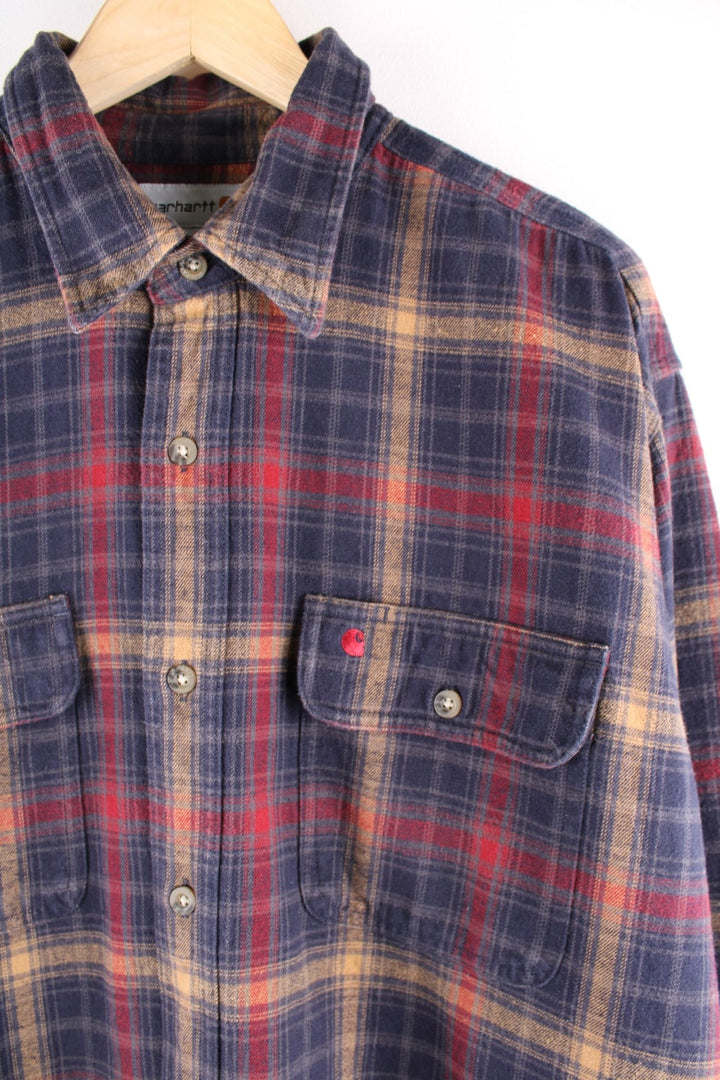  shirt in , red, and yellow check, with two buttoned breast pockets and an embroidered logo on the chest.