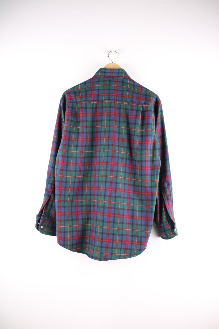 Pendleton 100% virgin wool button-down shirt in blue, green and red check, with one breast pocket.