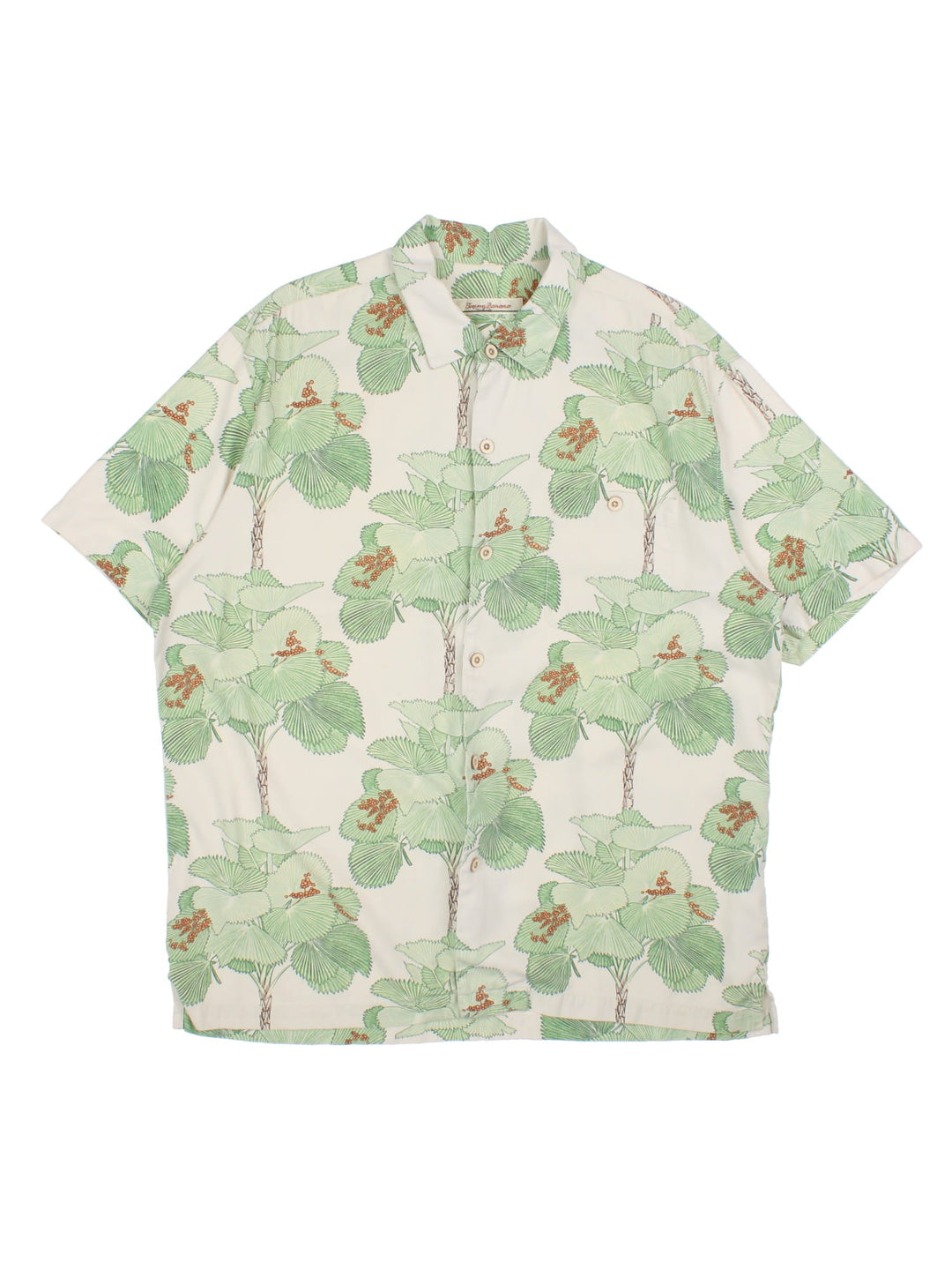 Tommy Bahama Hawiian shirt in a multicoloured colourway. The silk shirt has a green floral print, traditional wooden buttons and a patch pocket on the front.