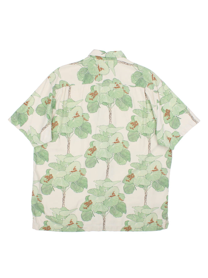 Tommy Bahama Hawiian shirt in a multicoloured colourway. The silk shirt has a green floral print, traditional wooden buttons and a patch pocket on the front.