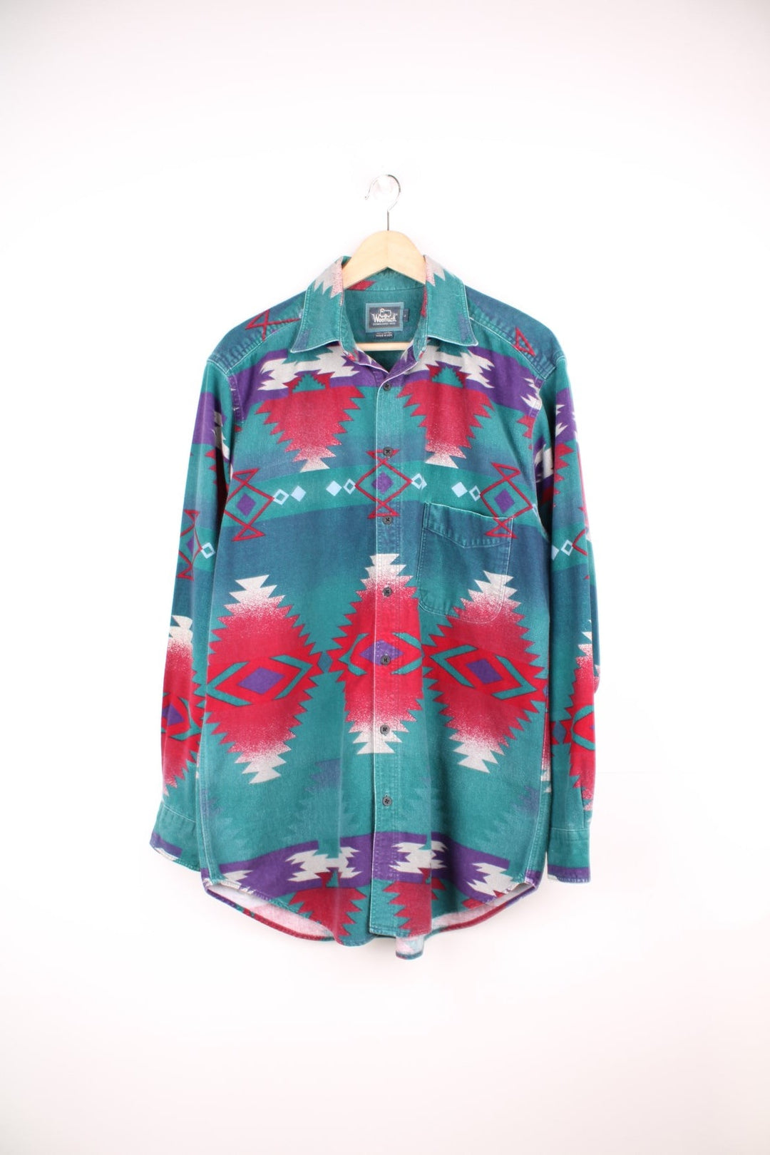 Vintage Woolrich Aztec Shirt in a green, red and purple patterned colourway, button up with a camp collar and has a chest pocket. 