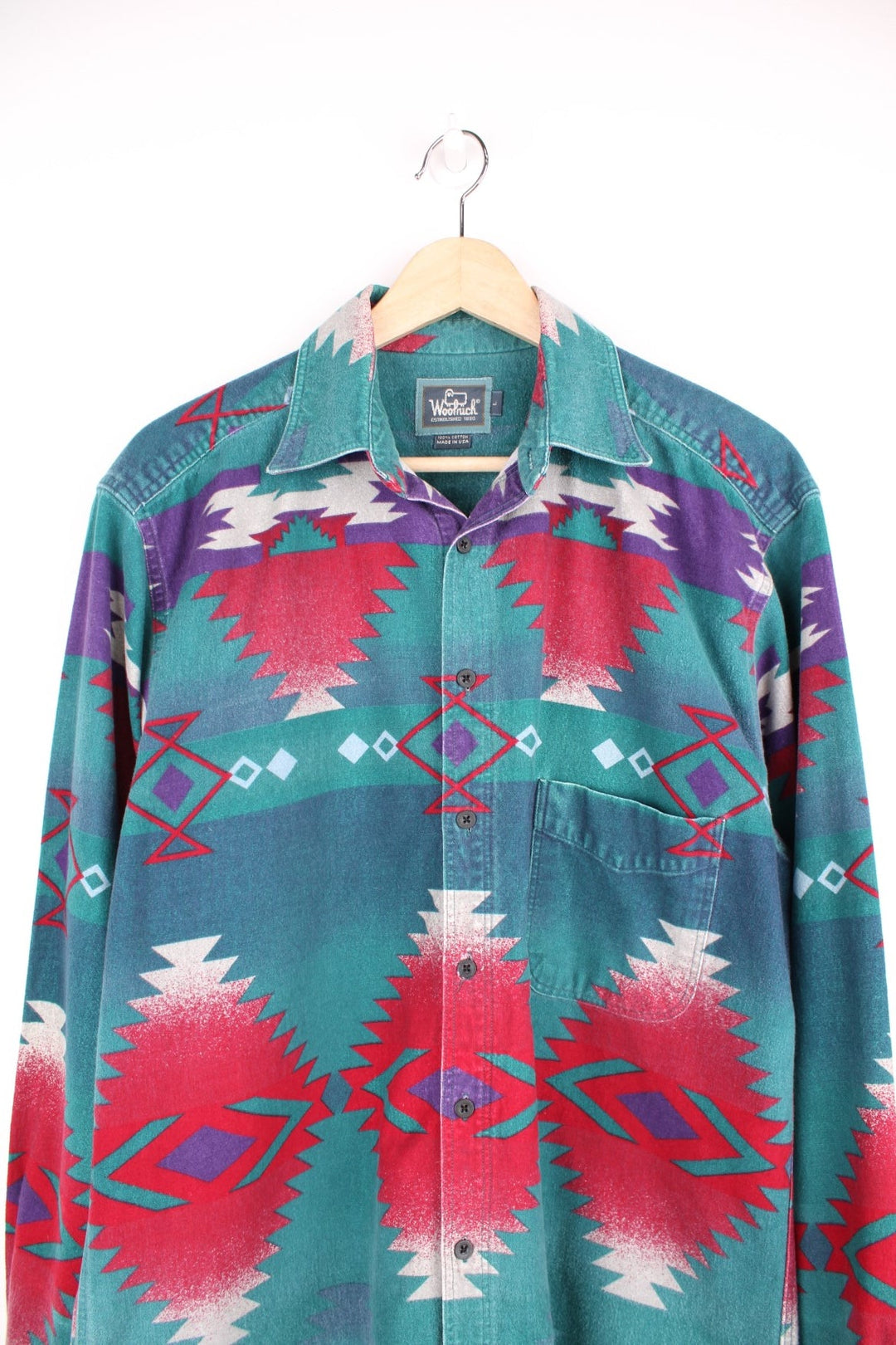 Vintage Woolrich Aztec Shirt in a green, red and purple patterned colourway, button up with a camp collar and has a chest pocket. 