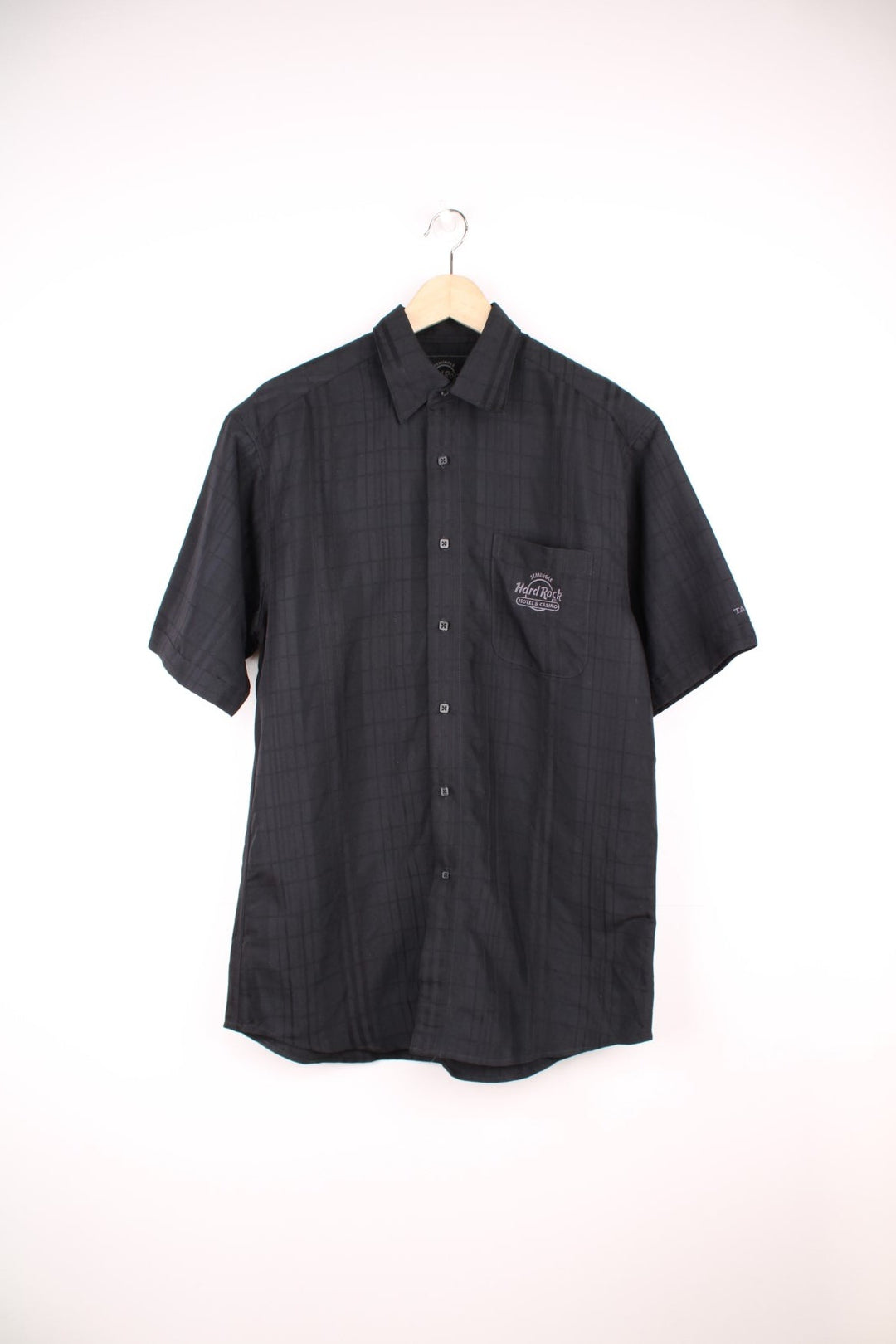 Vintage Hard Rock Cafe Shirt in a black plaid colourway, button up with a chest pocket, and has the logo embroidered on the front. 