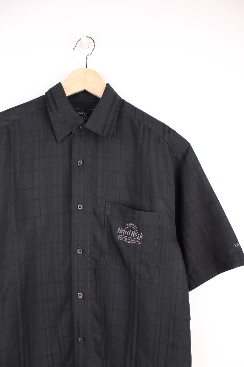 Vintage Hard Rock Cafe Shirt in a black plaid colourway, button up with a chest pocket, and has the logo embroidered on the front. 