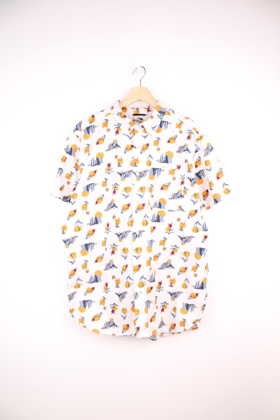 The North Face Desert Print Shirt in a white colourway with western desert designs printed all over, button up shirt and has a chest pocket. 