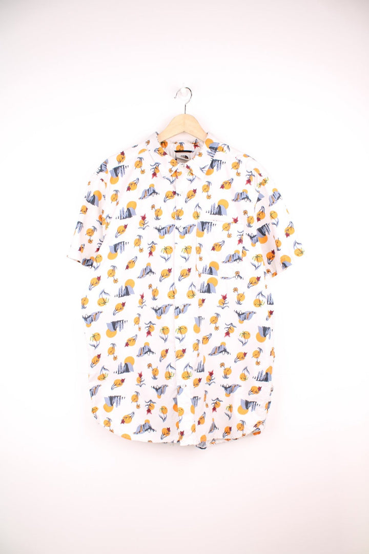 The North Face Desert Print Shirt in a white colourway with western desert designs printed all over, button up shirt and has a chest pocket. 