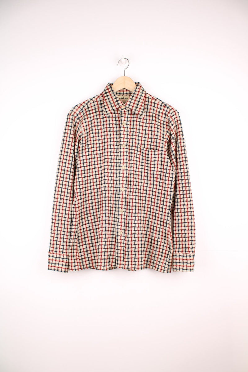 Vintage 70's Arrow Scrammbler Knit Shirt in a tan, red and blue checkered colourway, button up with a dagger collar, and has a chest pocket. 