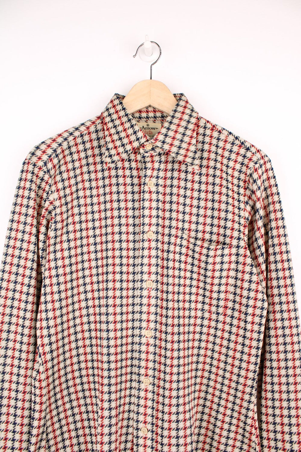 Vintage 70's Arrow Scrammbler Knit Shirt in a tan, red and blue checkered colourway, button up with a dagger collar, and has a chest pocket. 