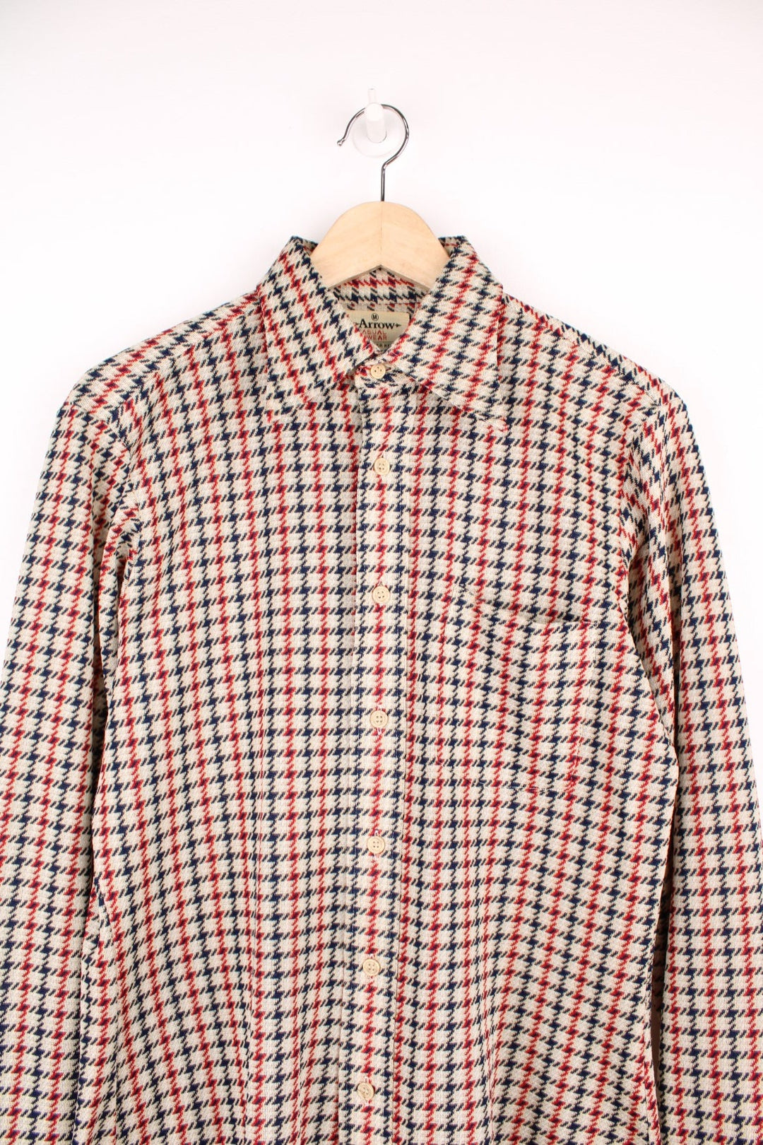 Vintage 70's Arrow Scrammbler Knit Shirt in a tan, red and blue checkered colourway, button up with a dagger collar, and has a chest pocket. 