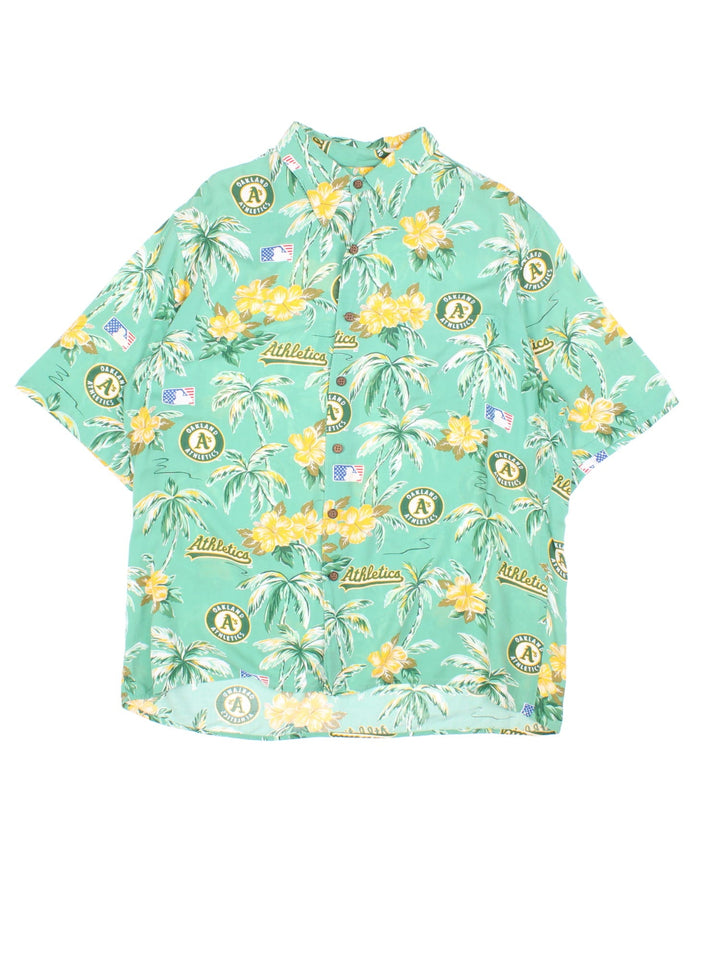 Oakland Athletics MLB Hawaiian Shirt in a green colourway, button up with a chest pocket, and has the logo and palm tree graphic printed all over.